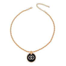 Load image into Gallery viewer, Full gold-tone rope chain necklace with black rhinestone ring pendant, lobster clasp, and extender chain.