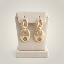 Load image into Gallery viewer, Word Up Jewel's & Accessories matte gold puffy anchor link dangle earrings with a scratched industrial finish.