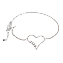 Load image into Gallery viewer, Silver chain belt with a crystal heart centerpiece and clear rhinestones, shown flat