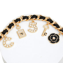 Load image into Gallery viewer, Anklet Black Woven Gold Chain Camellia Charms
