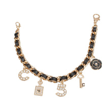 Load image into Gallery viewer, Mini Bucket Black Quilted Gold Camellia Luxe Bag
