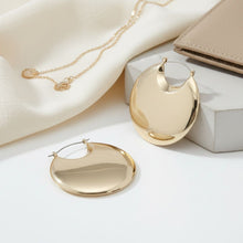 Load image into Gallery viewer, Huggie Gold Puffy Disc Crescent Hoop Earrings
