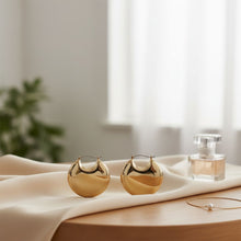 Load image into Gallery viewer, Huggie Gold Puffy Disc Crescent Hoop Earrings
