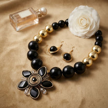 Load image into Gallery viewer, Black and Gold Jumbo Bead Flower Pendant Necklace
