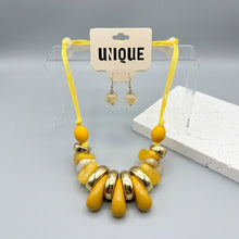 Load image into Gallery viewer, Yellow &amp; Gold Resin Teardrop Cord Tribal Necklace
