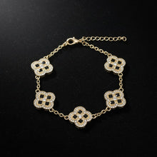 Load image into Gallery viewer, Black Encrusted Quatrefoil Motif Gold Bracelet
