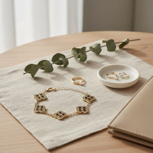 Load image into Gallery viewer, Black Encrusted Quatrefoil Motif Gold Bracelet
